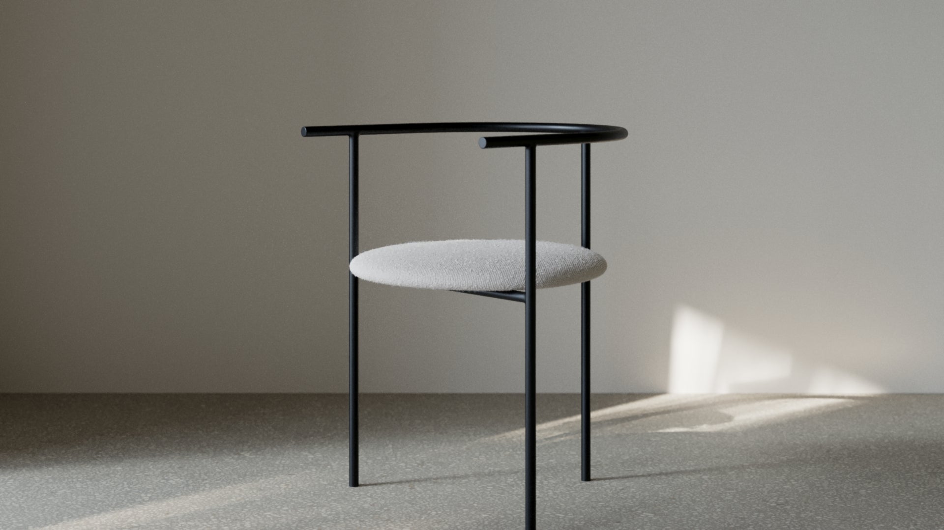 Modern black chair with a gray cushion on a neutral background
