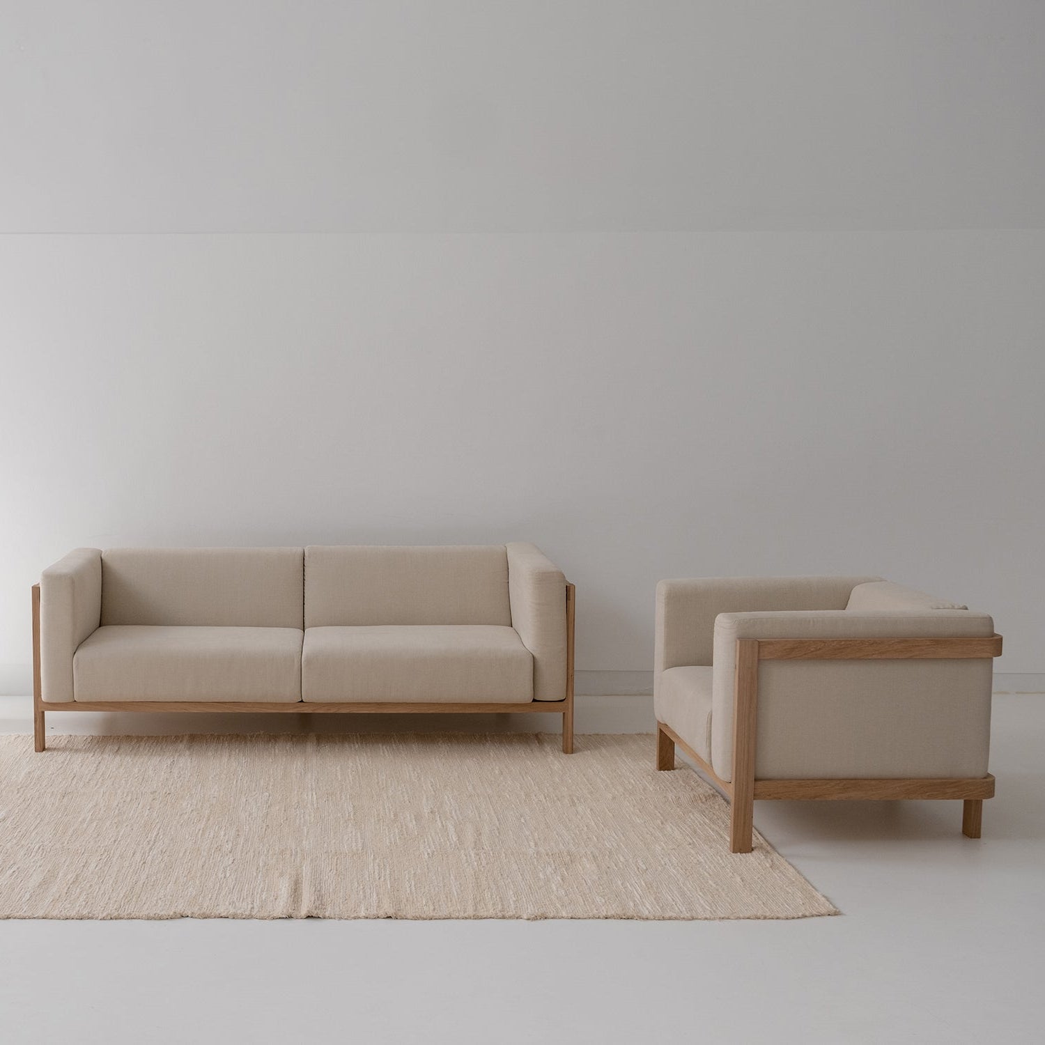 2x LIFT – Lounge Chair  & Three Seat Sofa in Solid Wood and Customizable Seat